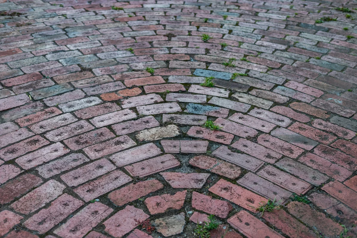 A stunning brick driveway illustrating design flexibility with edging A stunning brick driveway illustrating design flexibility with edging