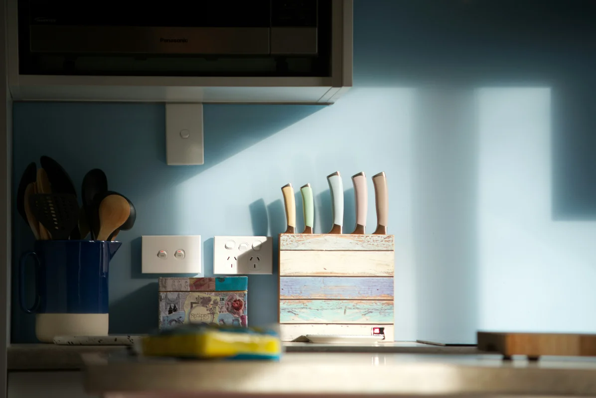 An organized kitchen workspace with clean utensils and ingredients An organized kitchen workspace with clean utensils and ingredients