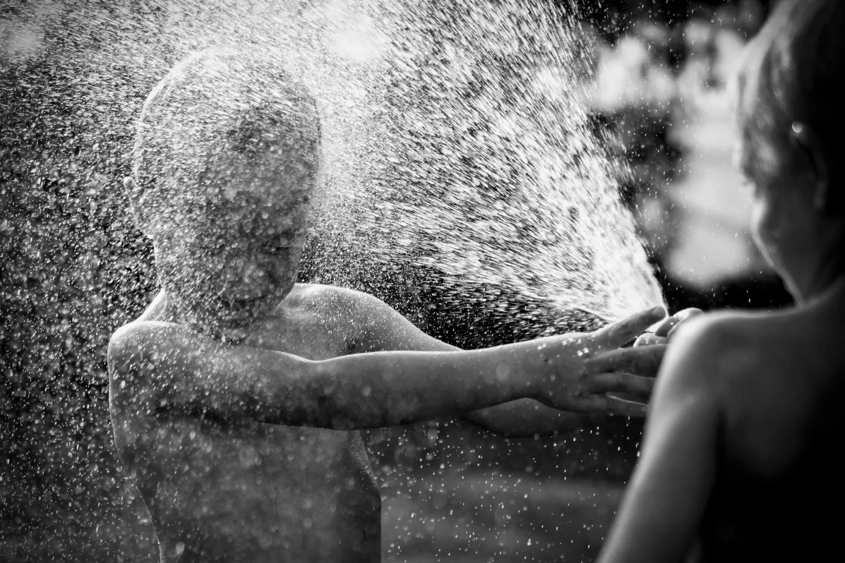 A person taking a shower after being outdoors to wash off ticks A person taking a shower after being outdoors to wash off ticks