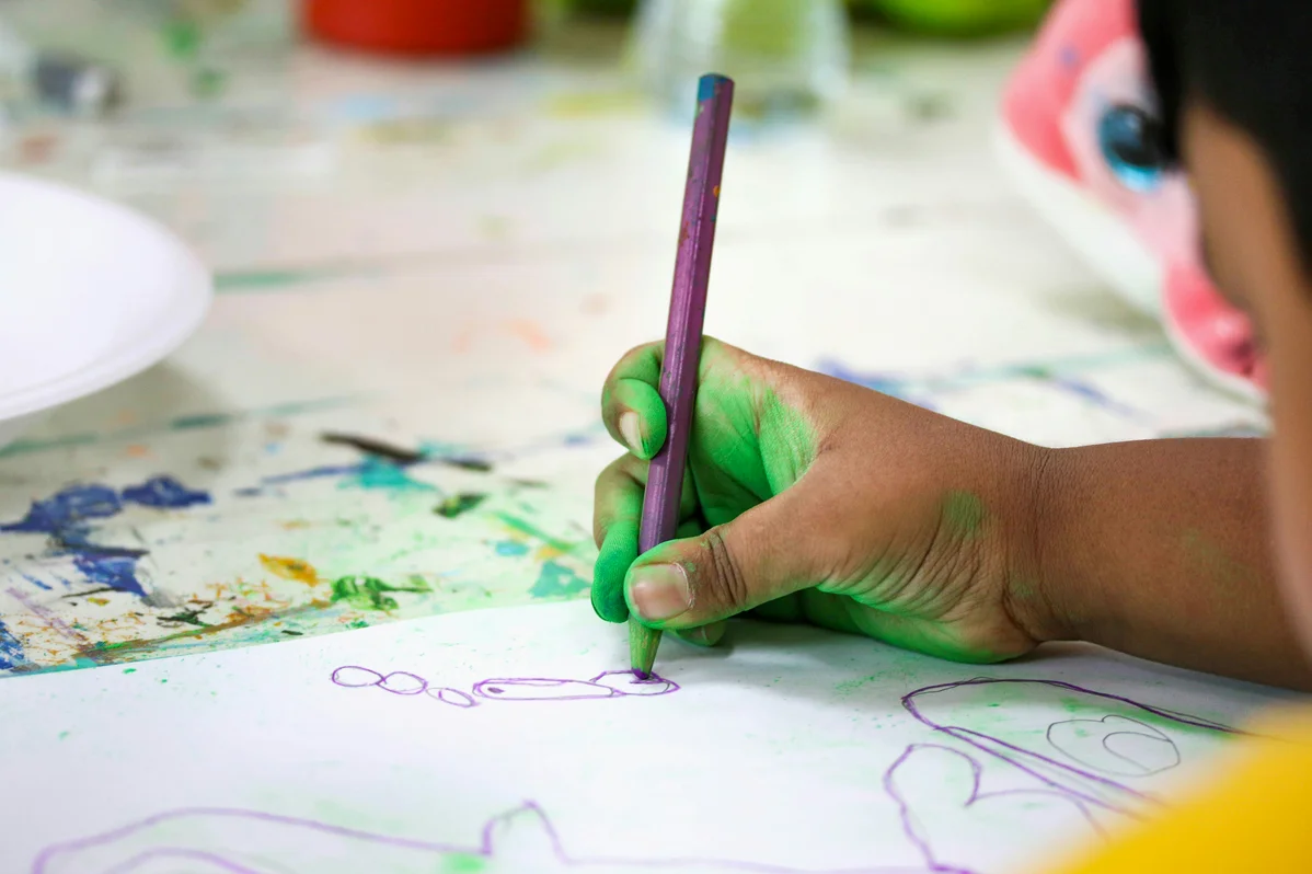 colorful art supplies on a child's desk colorful art supplies on a child's desk