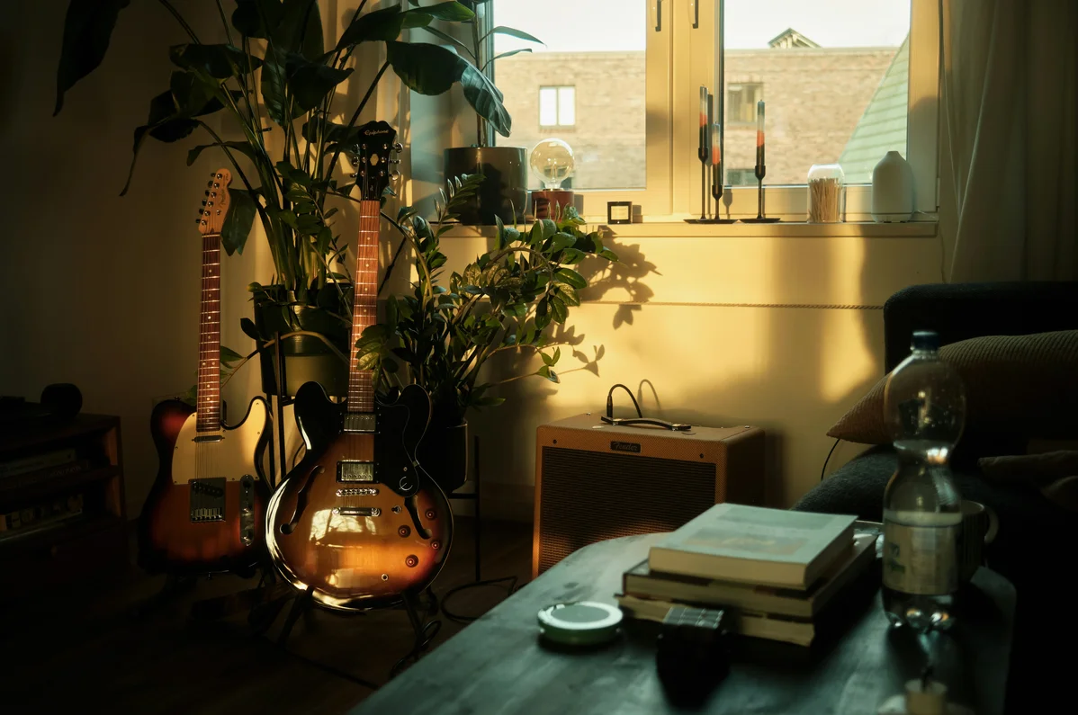 An organized home featuring a guitar wall hook, improving accessibility An organized home featuring a guitar wall hook, improving accessibility
