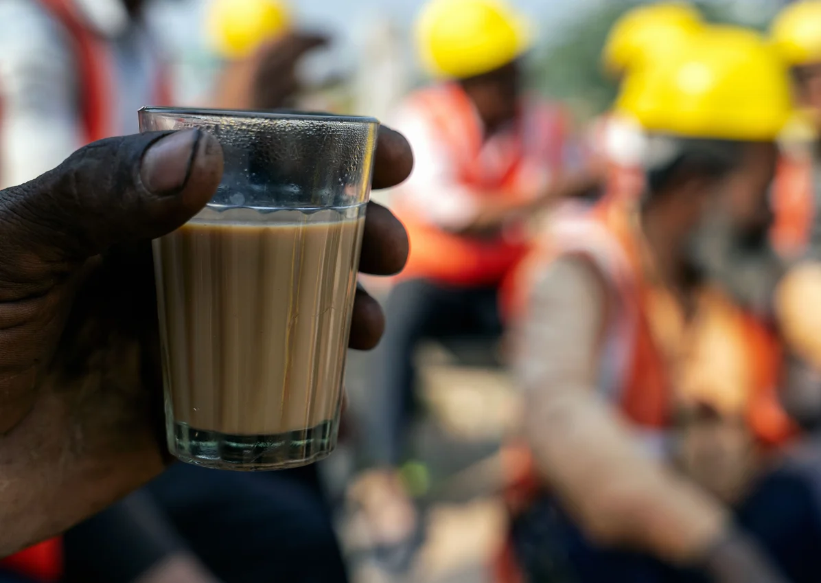 handyman taking a break with a drink during work handyman taking a break with a drink during work