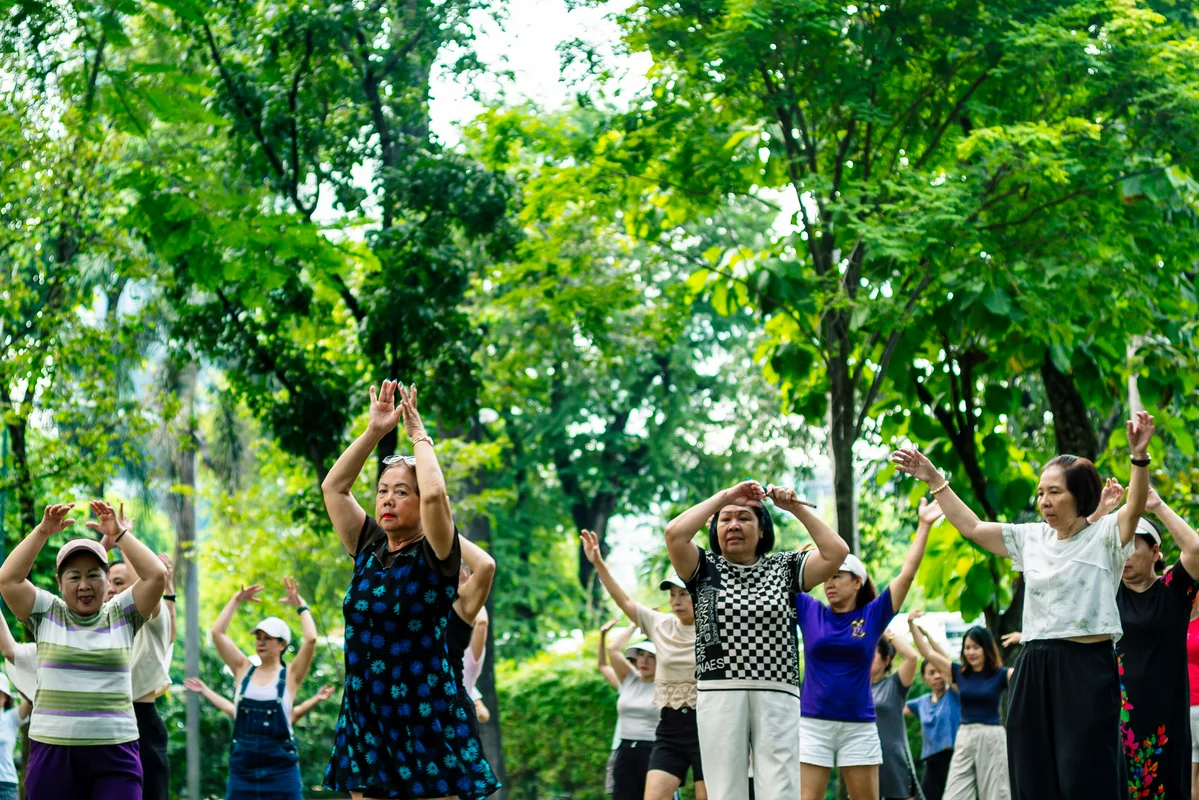 A woman participating in outdoor fitness activities as part of her recovery after cancer A woman participating in outdoor fitness activities as part of her recovery after cancer