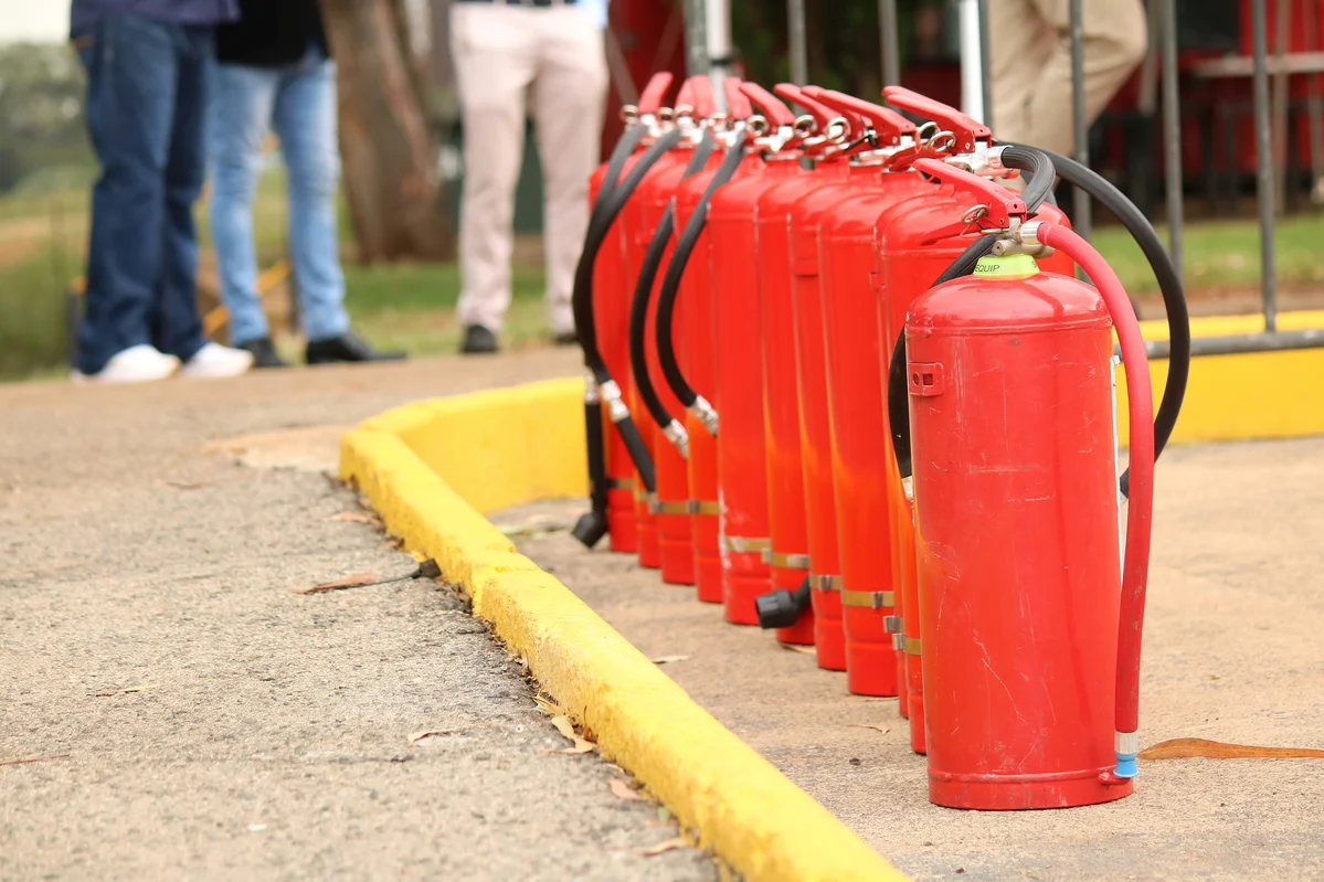 Various types of fire extinguishers displayed together Various types of fire extinguishers displayed together