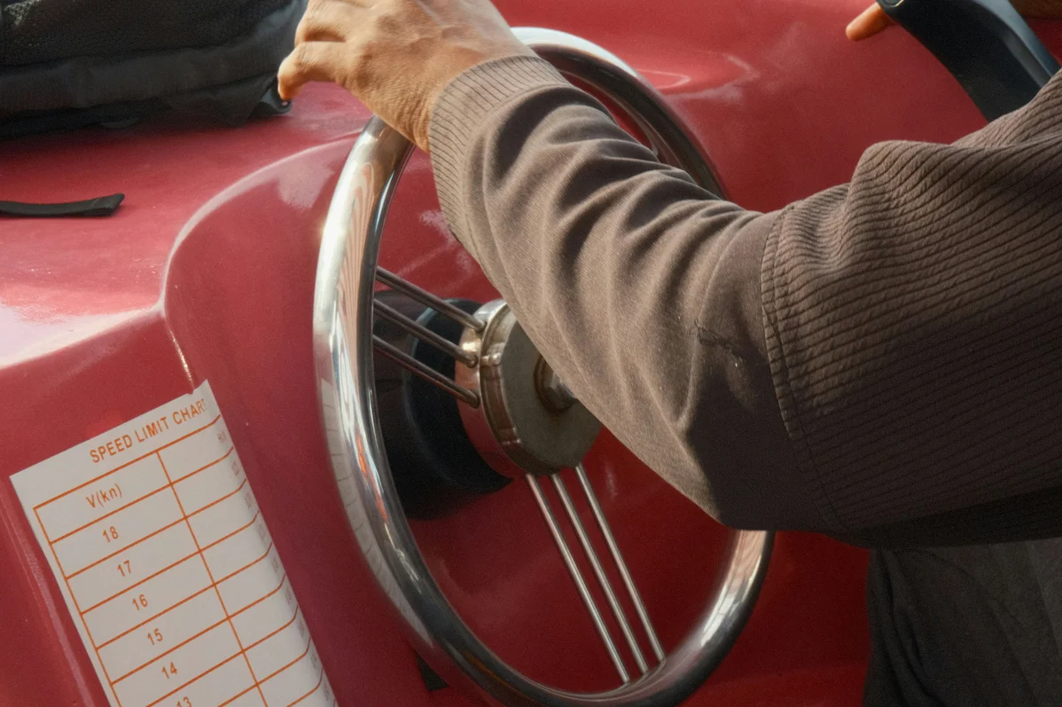 A person inspecting a fire extinguisher for maintenance A person inspecting a fire extinguisher for maintenance