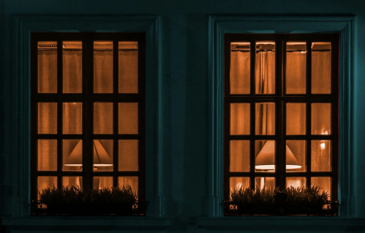 a homeowner inspecting windows for security a homeowner inspecting windows for security