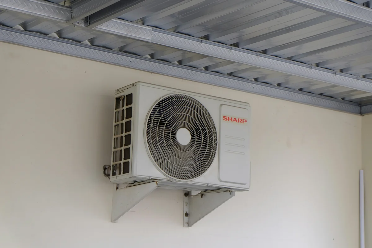 a secured air conditioning unit with a protective cage a secured air conditioning unit with a protective cage