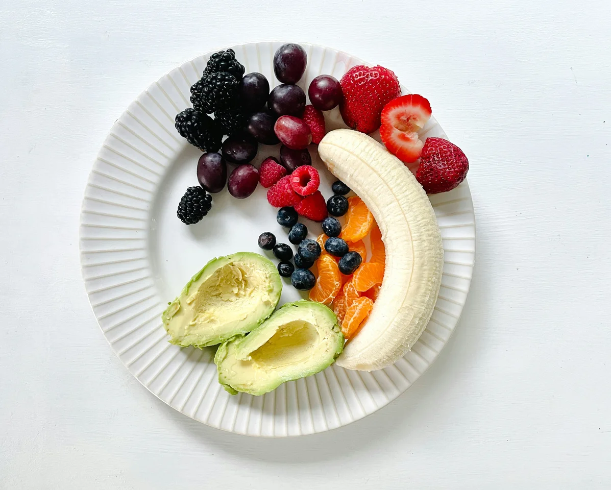 Plate of healthy foods rich in fats for skin and body health Plate of healthy foods rich in fats for skin and body health