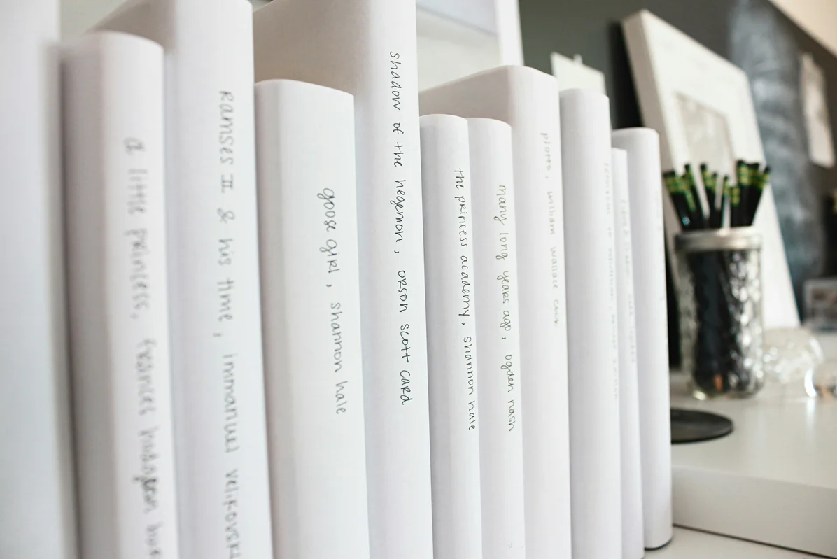 Books organized by size on a stylish shelf Books organized by size on a stylish shelf