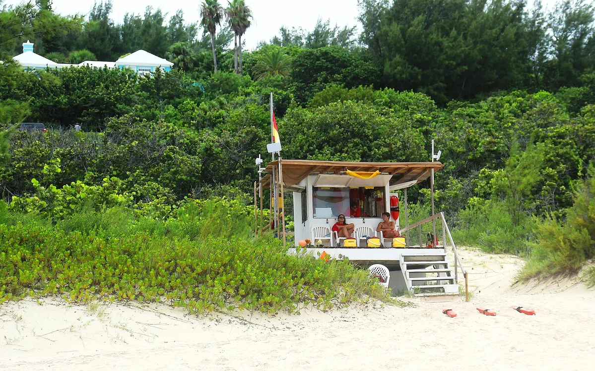 A sand collection station outside a beach cottage A sand collection station outside a beach cottage
