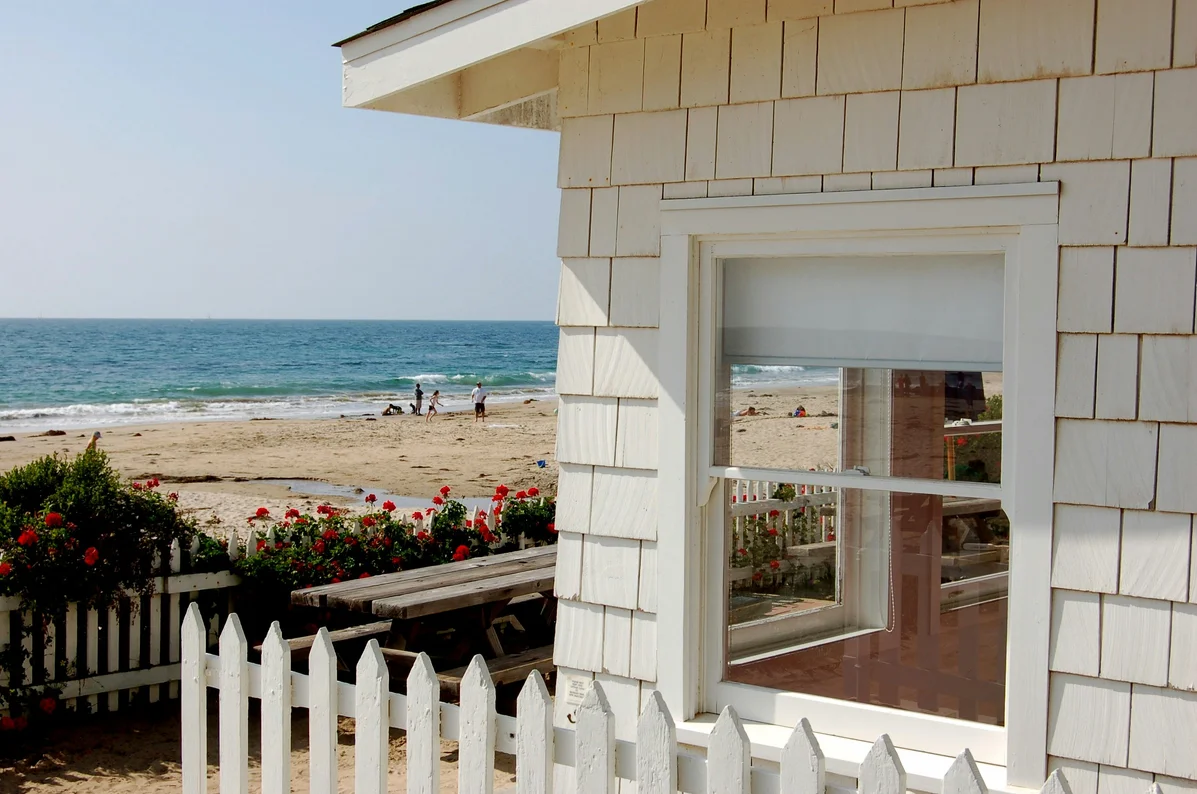A sand-free zone at the entrance of a beach cottage with a rug A sand-free zone at the entrance of a beach cottage with a rug