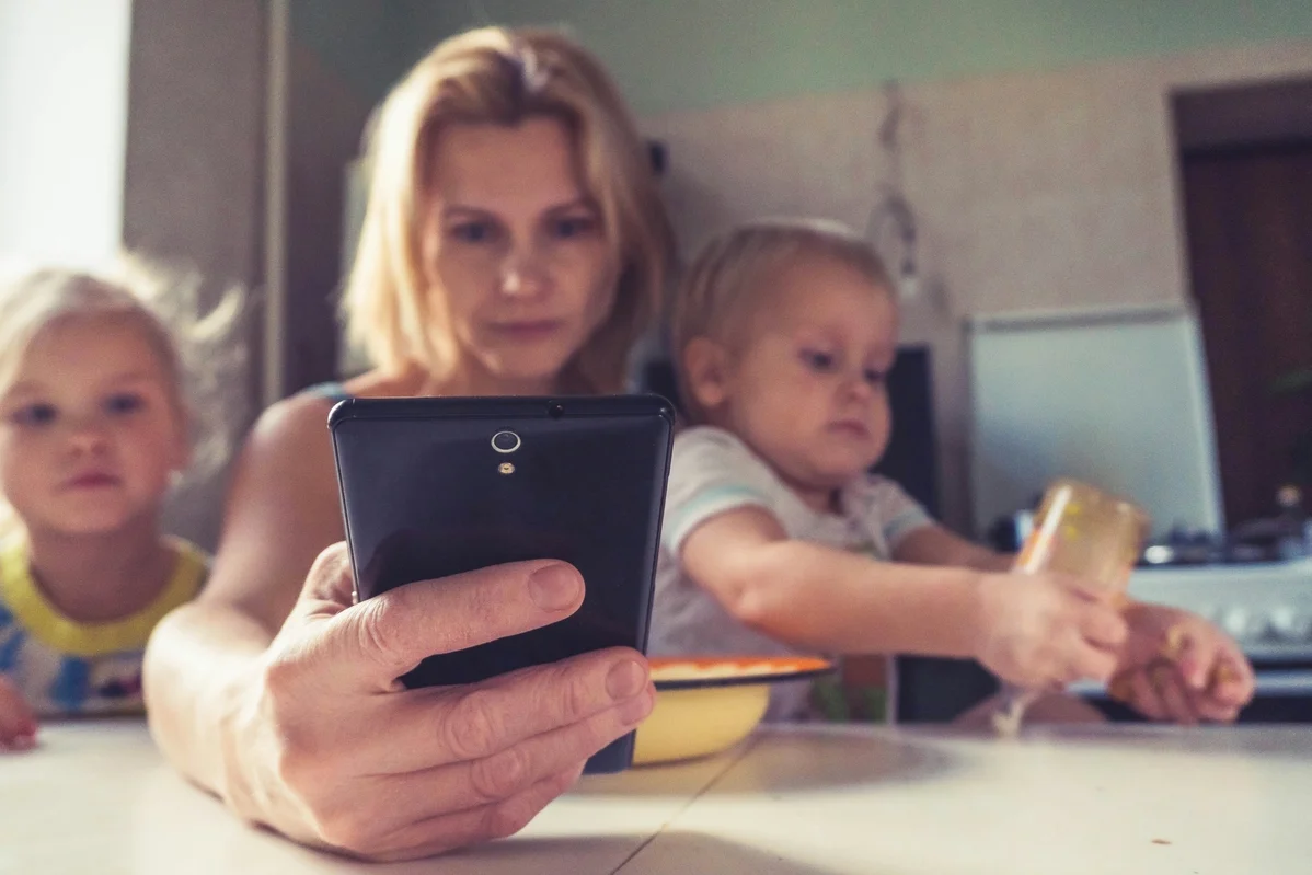 Different generations using smartphones, showcasing varying internet culture perspectives Different generations using smartphones, showcasing varying internet culture perspectives