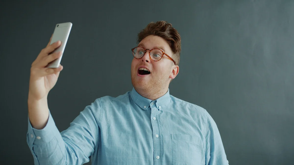 Group of people reacting to memes on their smartphones, representing TikTok culture Group of people reacting to memes on their smartphones, representing TikTok culture