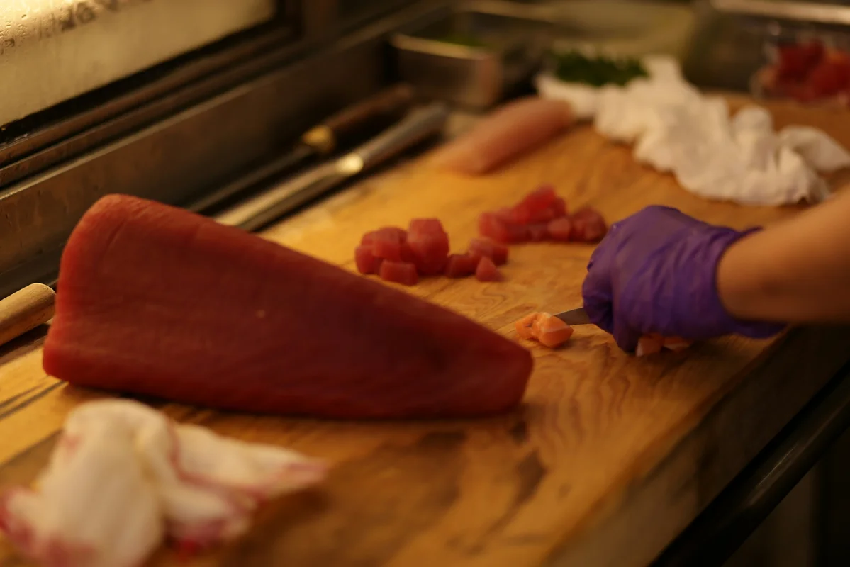 Fresh salmon fillets on a wooden cutting board Fresh salmon fillets on a wooden cutting board