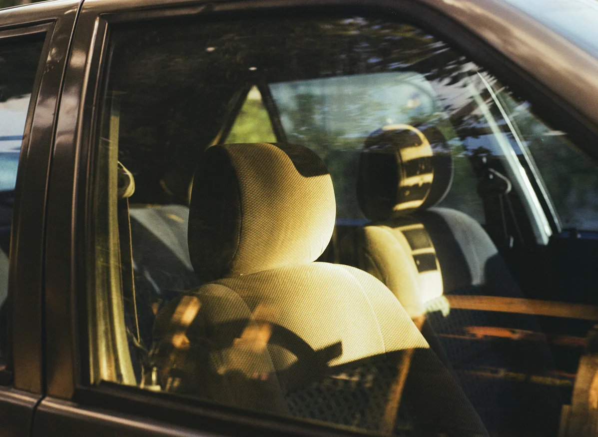 person cleaning car windows after tint removal person cleaning car windows after tint removal