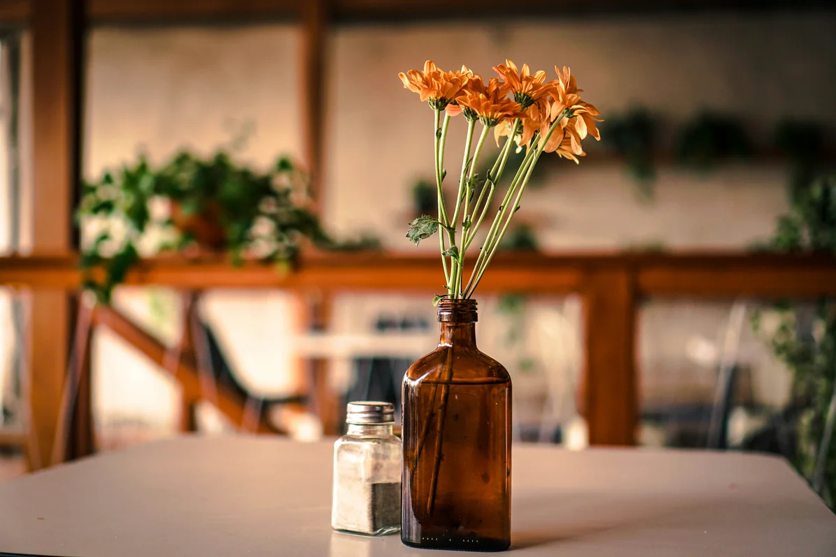 A bottle of essential oils on a table ready for use against wasps A bottle of essential oils on a table ready for use against wasps
