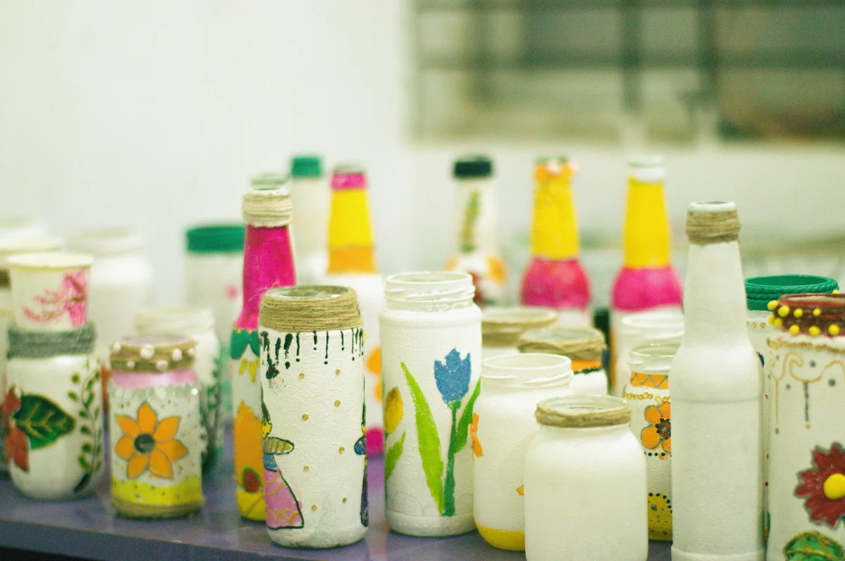 Upcycled candle jars used as home decor and organizers Upcycled candle jars used as home decor and organizers