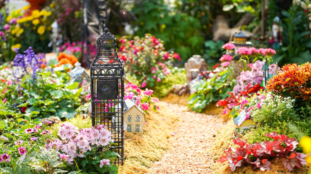 decorated shovel placed in a flower garden as decor decorated shovel placed in a flower garden as decor